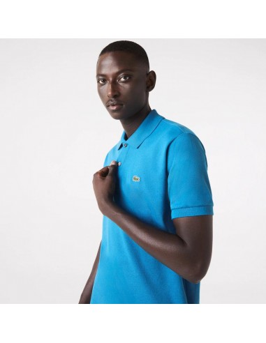 Polo L.12.12 Lacoste bleu Les êtres humains sont 